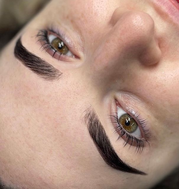 Dark, sculpted brows with fine hairstroke detail