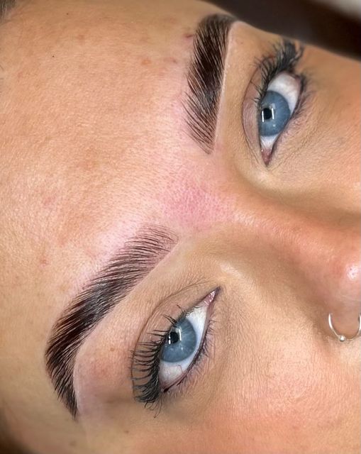 Defined brows and a lash lift on blue eyes