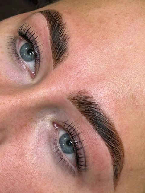 Laminated dark brow and lifted lashes close-up
