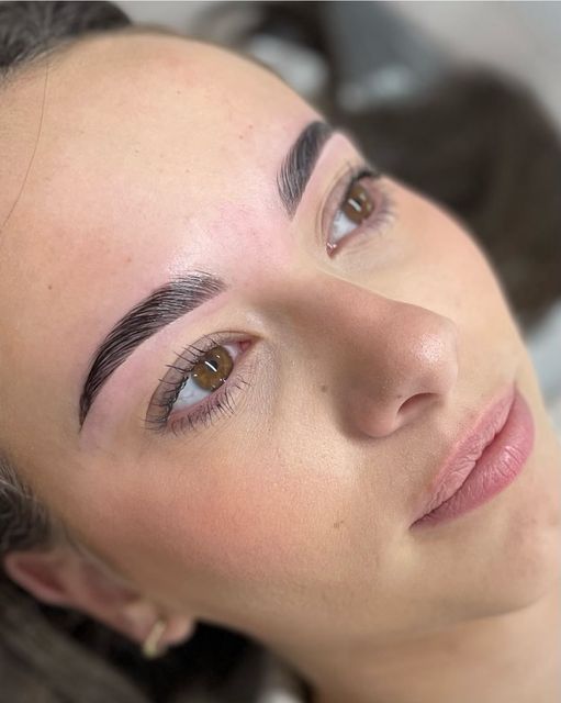 Soft sculpted brow and lifted lashes on a relaxed client