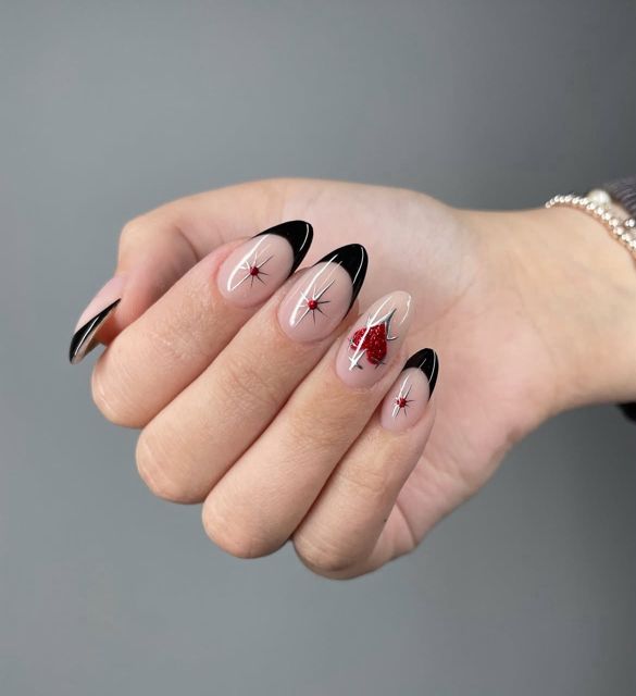 Black French tip almond nails with fine detail nail art