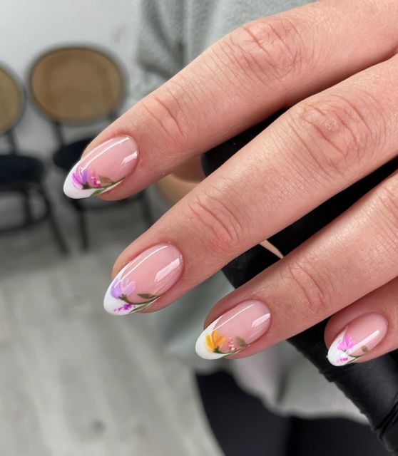 Soft French tip gel nails with hand painted floral detail