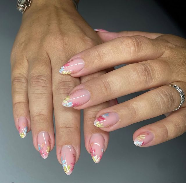 Pastel French tip nails with iridescent detail