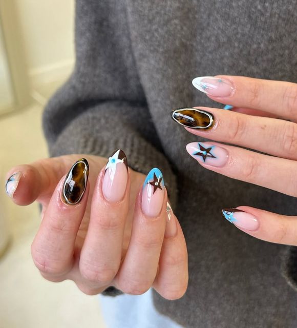 Almond nails with tortoiseshell and star nail art