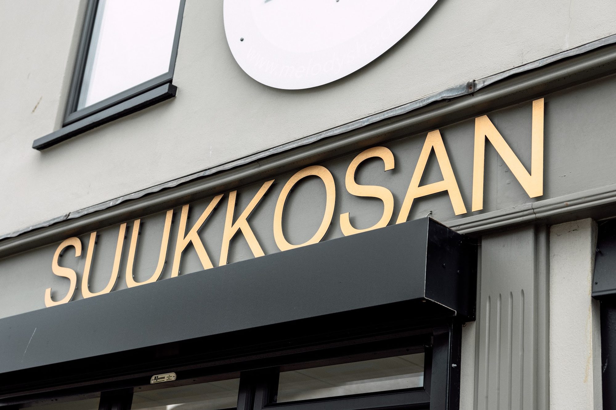 The Suukkosan shopfront sign on Thomas Street, Llanelli